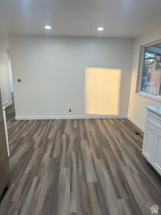 4129 S 3600 W, West Valley City, UT 84119 - spare room with dark wood-type flooring, recessed lighting, visible vents, and baseboards