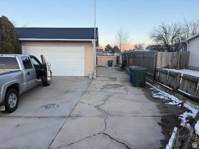 4129 S 3600 W, West Valley City, UT 84119 - garage at dusk featuring fence