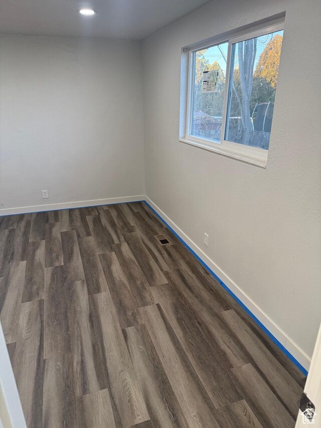4129 S 3600 W, West Valley City, UT 84119 - empty room with dark wood-style flooring, visible vents, and baseboards
