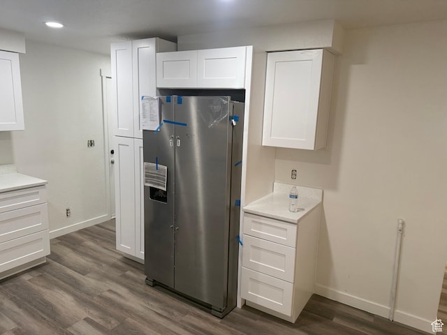 4129 S 3600 W, West Valley City, UT 84119 - kitchen featuring baseboards, dark wood finished floors, freestanding refrigerator, light countertops, and white cabinetry