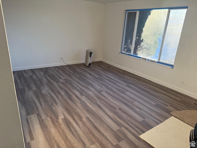 4129 S 3600 W, West Valley City, UT 84119 - spare room featuring baseboards and dark wood-type flooring