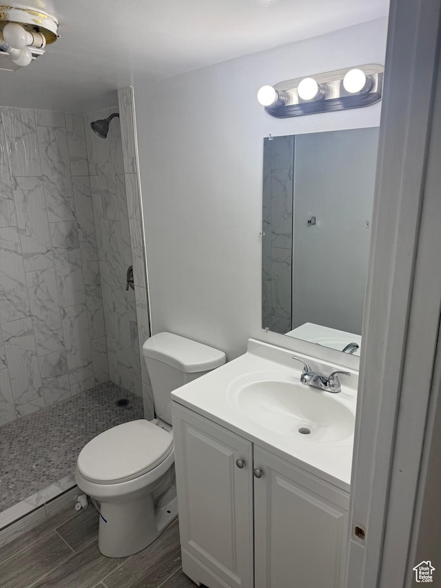 4129 S 3600 W, West Valley City, UT 84119 - full bathroom with a stall shower, vanity, toilet, and wood tiled floor