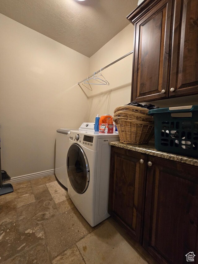 935 W 2100 N, Pleasant View, UT 84404 - laundry room featuring cabinet space, washer and clothes dryer, baseboards, light stone finish flooring, and a textured ceiling