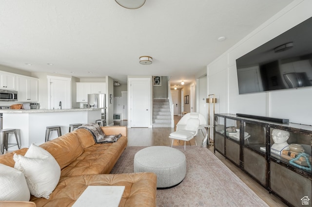 1863 S 900 E, Lehi, UT 84043 - living room with stairs and light wood-style floors