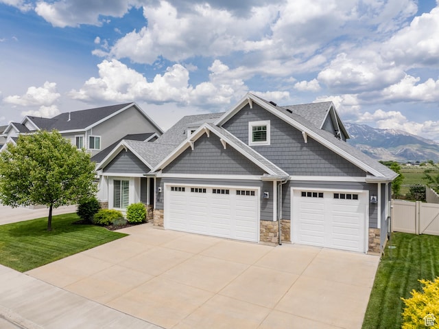 1863 S 900 E, Lehi, UT 84043 - craftsman house with stone siding, concrete driveway, a garage, a mountain view, and a shingled roof