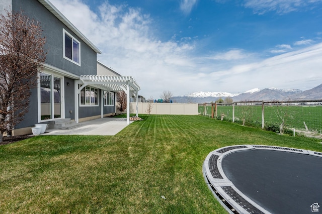 1863 S 900 E, Lehi, UT 84043 - view of yard featuring fence, a pergola, a patio area, a mountain view, and a trampoline