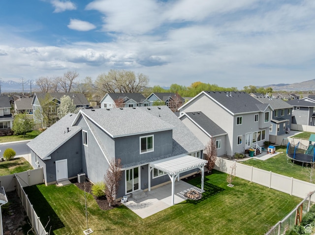 1863 S 900 E, Lehi, UT 84043 - back of house featuring a fenced backyard, a residential view, a patio, and a trampoline