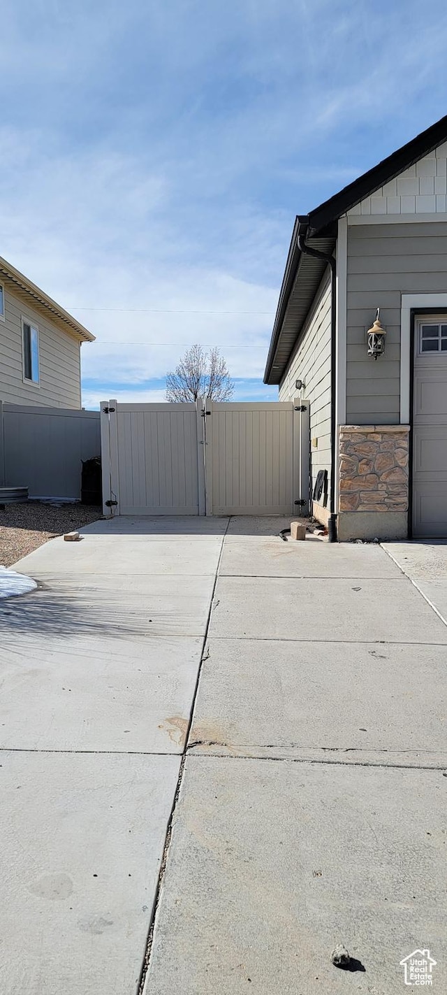 view of patio / terrace featuring a gate and fence