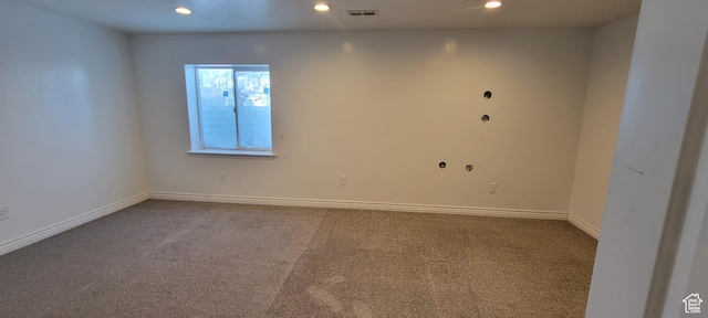 empty room featuring recessed lighting, carpet, visible vents, and baseboards