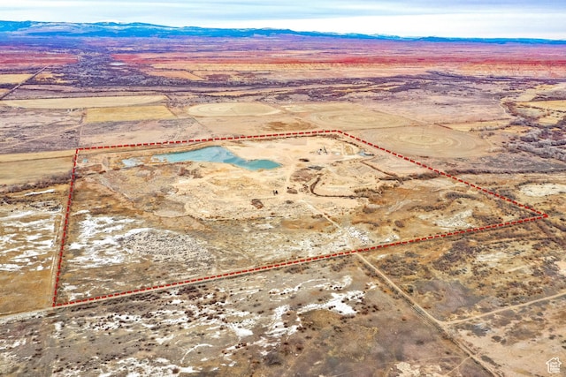 drone / aerial view featuring a mountain view