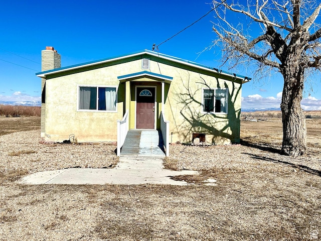 7998 E 5250 S, Randlett, UT 84063 - bungalow-style house with a chimney and stucco siding