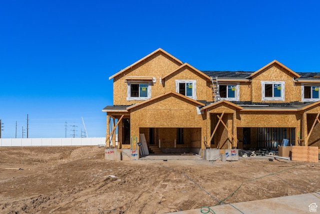 unfinished property featuring roof mounted solar panels
