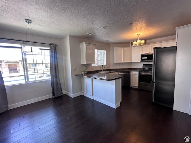 196 E Spencer Peak Way E Unit D6, Draper, UT 84020 - kitchen featuring appliances with stainless steel finishes, a peninsula, a textured ceiling, white cabinets, and dark countertops
