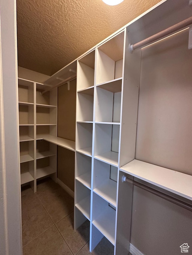 196 E Spencer Peak Way E Unit D6, Draper, UT 84020 - walk in closet featuring dark tile patterned flooring