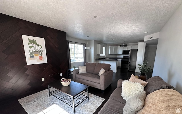 196 E Spencer Peak Way E Unit D6, Draper, UT 84020 - living room featuring a textured ceiling