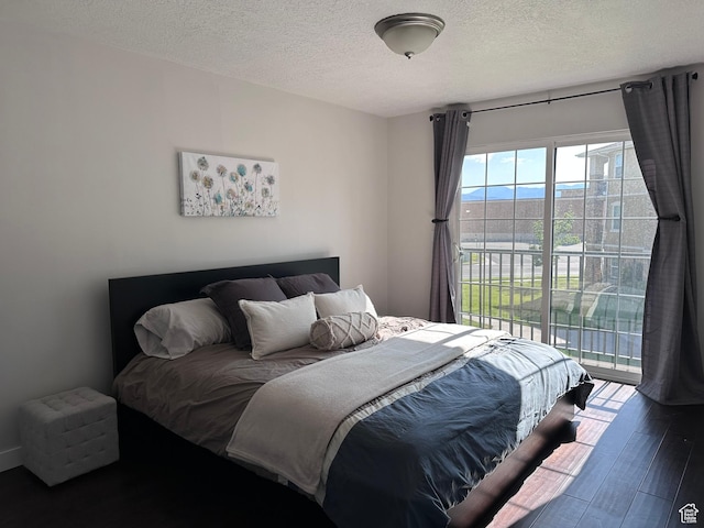 196 E Spencer Peak Way E Unit D6, Draper, UT 84020 - bedroom with access to outside, a textured ceiling, and wood finished floors