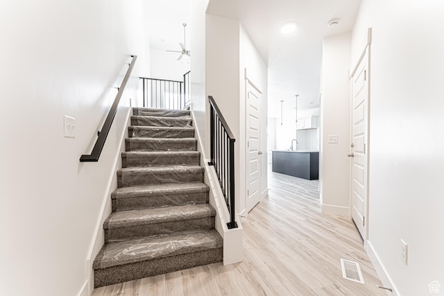 716 W 4500 S Unit 302, Mapleton, UT 84664 - staircase featuring ceiling fan, wood finished floors, and baseboards