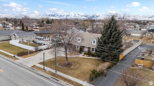 aerial view of residential area with a mountain backdrop