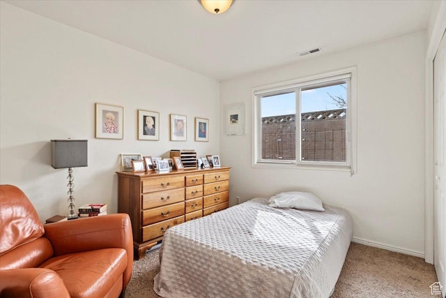bedroom featuring carpet floors and baseboards