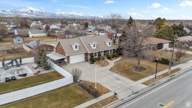 aerial view of residential area with a mountainous background