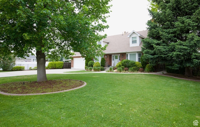 view of front of house featuring driveway, a garage, brick siding, and a shingled roof