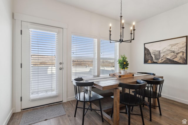 4473 E Hurstbourne Dr, Eagle Mountain, UT 84005 - dining room with a chandelier, wood finished floors, and baseboards