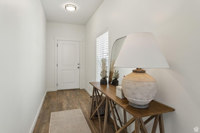 4473 E Hurstbourne Dr, Eagle Mountain, UT 84005 - doorway to outside featuring dark wood-type flooring and baseboards