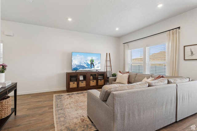 4473 E Hurstbourne Dr, Eagle Mountain, UT 84005 - living area with baseboards, dark wood-type flooring, and recessed lighting