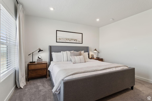 4473 E Hurstbourne Dr, Eagle Mountain, UT 84005 - bedroom with baseboards, dark carpet, and recessed lighting