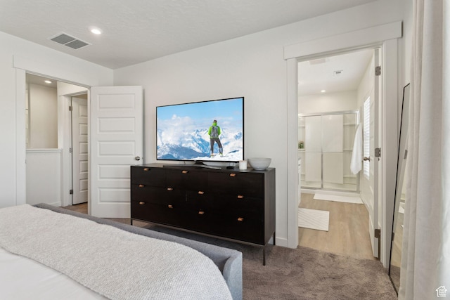 4473 E Hurstbourne Dr, Eagle Mountain, UT 84005 - bedroom featuring recessed lighting, visible vents, and ensuite bathroom