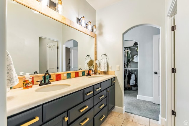 802 Leda Ln, Santa Clara, UT 84765 - full bath with a spacious closet, double vanity, a sink, and tile patterned floors