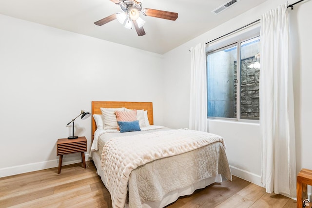 802 Leda Ln, Santa Clara, UT 84765 - bedroom featuring light wood-style floors, baseboards, visible vents, and ceiling fan