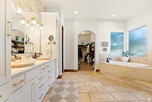 802 Leda Ln, Santa Clara, UT 84765 - full bath featuring a spacious closet, recessed lighting, a sink, and stone tile floors