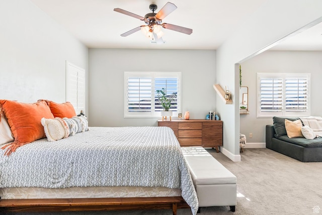802 Leda Ln, Santa Clara, UT 84765 - carpeted bedroom with multiple windows, baseboards, and a ceiling fan