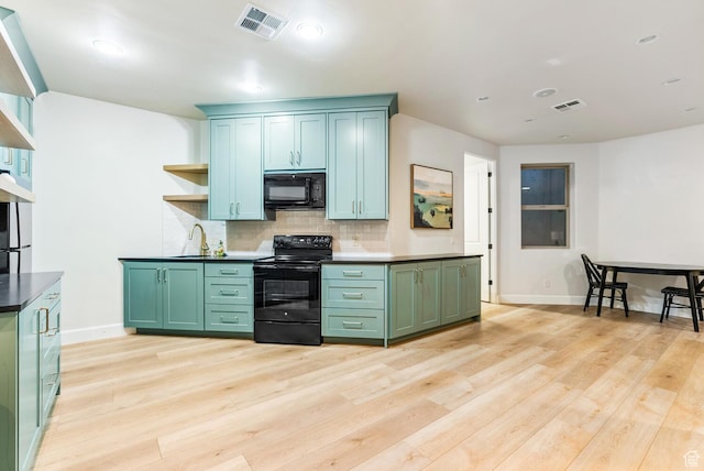 802 Leda Ln, Santa Clara, UT 84765 - kitchen with green cabinetry, visible vents, black appliances, and open shelves