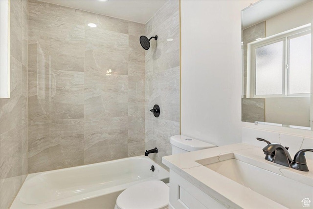 bathroom with toilet, shower / bath combination, and vanity