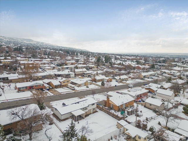 snowy aerial view with a residential view