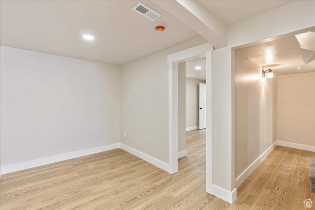 interior space with light wood-style floors, baseboards, visible vents, and recessed lighting