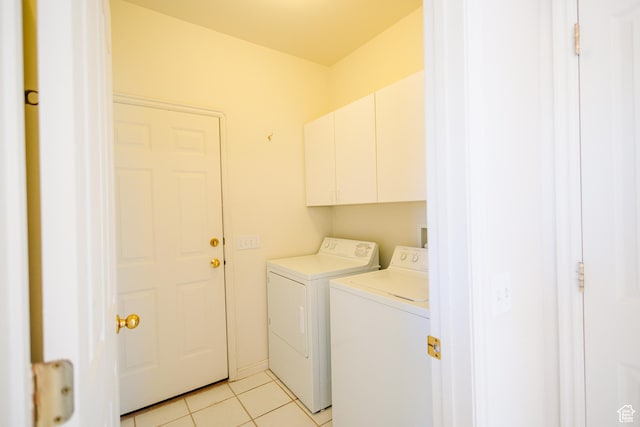 524 S Oak Ln W Unit 3, Tooele, UT 84074 - laundry area with cabinet space, light tile patterned floors, and washer and clothes dryer