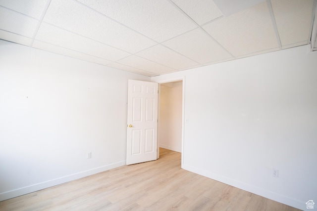 524 S Oak Ln W Unit 3, Tooele, UT 84074 - unfurnished room with light wood-style flooring, a paneled ceiling, and baseboards