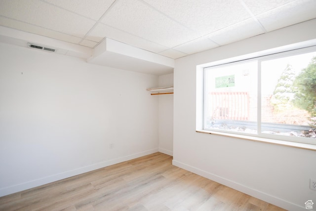 524 S Oak Ln W Unit 3, Tooele, UT 84074 - unfurnished room featuring a paneled ceiling, light wood-style floors, baseboards, and visible vents