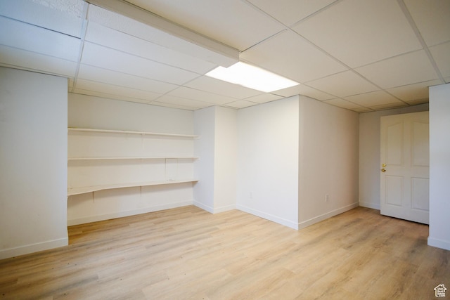 524 S Oak Ln W Unit 3, Tooele, UT 84074 - finished below grade area featuring light wood-style floors, baseboards, and a drop ceiling