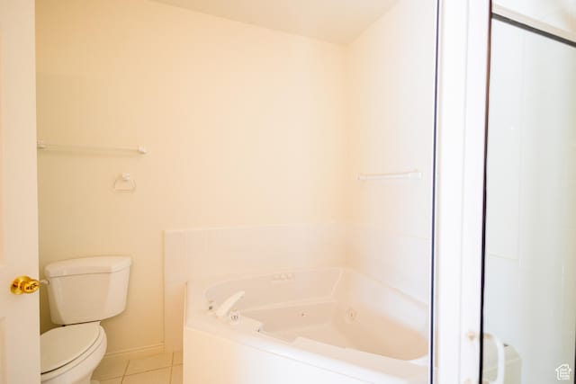 524 S Oak Ln W Unit 3, Tooele, UT 84074 - bathroom featuring tile patterned flooring, baseboards, a jetted tub, and toilet