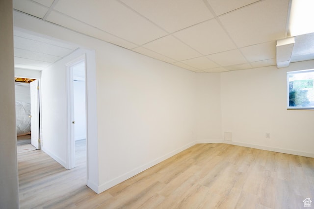 524 S Oak Ln W Unit 3, Tooele, UT 84074 - basement featuring light wood-type flooring, a paneled ceiling, and baseboards