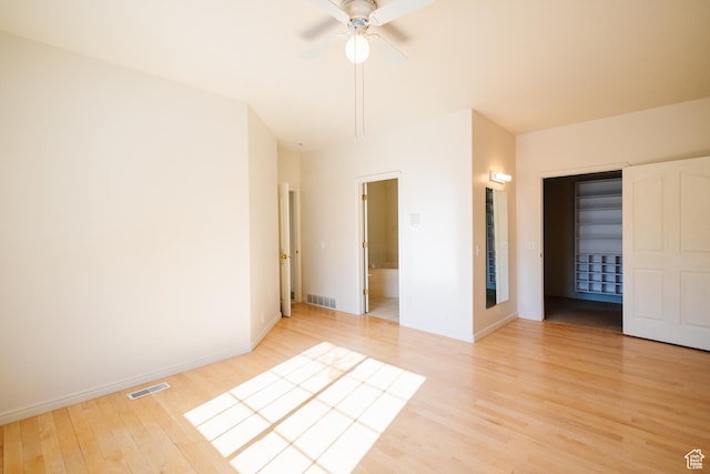 524 S Oak Ln W Unit 3, Tooele, UT 84074 - empty room with light wood-type flooring, baseboards, visible vents, and ceiling fan