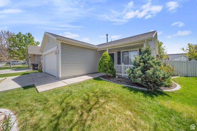 single story home featuring concrete driveway, fence, a front yard, and a garage