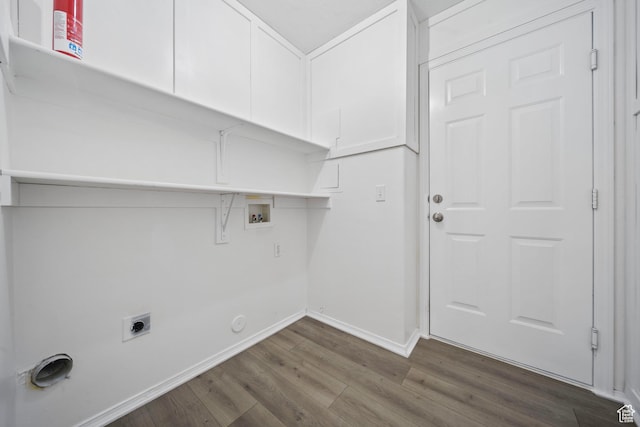 clothes washing area featuring hookup for an electric dryer, laundry area, dark wood-style flooring, baseboards, and hookup for a washing machine