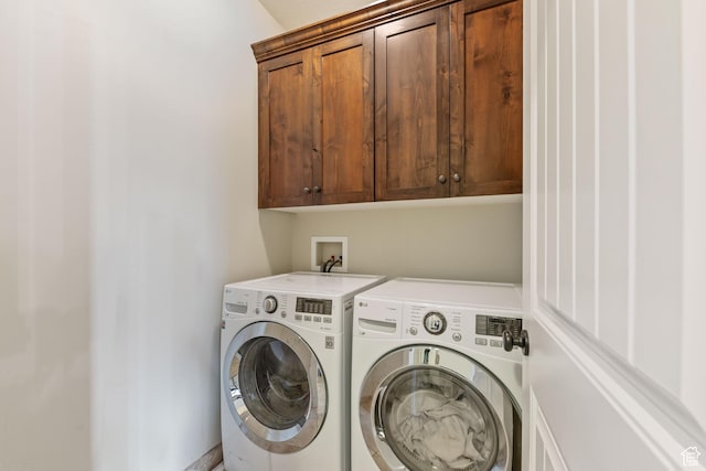 laundry room with cabinet space and independent washer and dryer