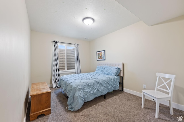 bedroom featuring carpet floors and baseboards