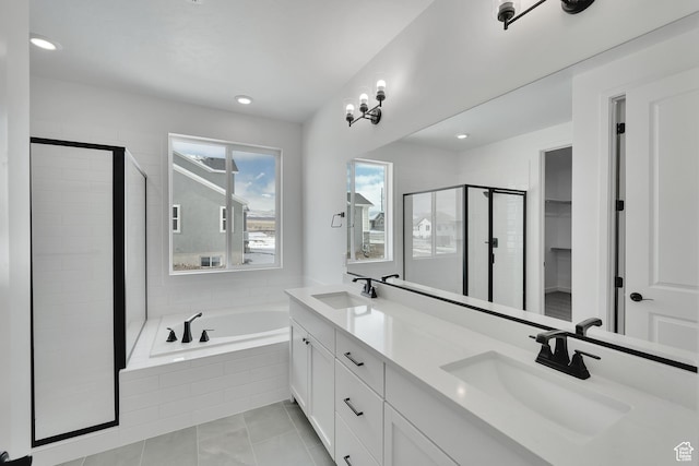 376 W Emma St Unit 623, Grantsville, UT 84029 - bathroom featuring a shower stall, double vanity, a bath, tile patterned floors, and recessed lighting
